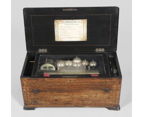 A large music box with an 8 air mechanism, striking on bells and a drum and with start/stop and change/repeat levers. With a 