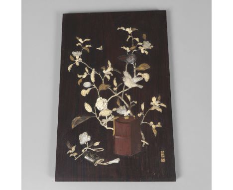 Meiji period, the rosewood panel inlaid in bone, ivory, mother of pearl and gilding, with an intricate design including a bir