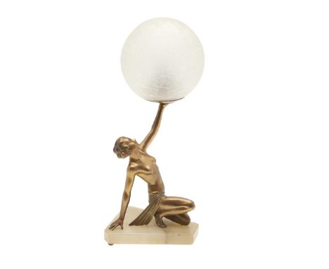 A gilded metal figure of a kneeling girl, with arm outstretched and holding the light fitting, and mounted on a shaped onyx o