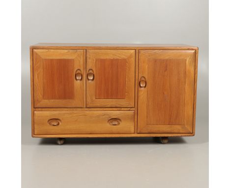 The light elm sideboard with a two door cupboard with internal shelf, above a single drawer and with a flanking with internal