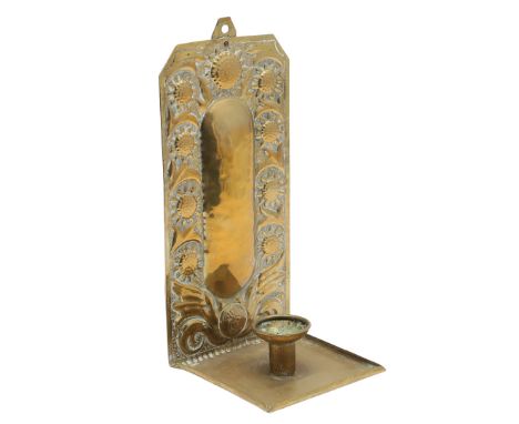 The rectangular shaped back repousse decorated with a foliate design, and with a single sconce. The back plate stamped 'J.P, 