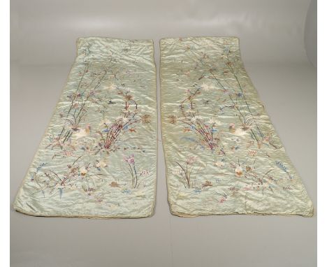 A large pair of late 19thc silk curtains, brightly embroidered with a Cockerel and chicks amongst flowering bamboo, birds, fl