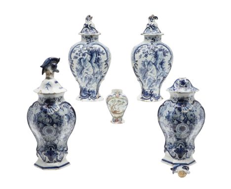 Possibly 18thc, including a large pair of delft lidded vases, each painted with flowers and foliage and with motifs in relief