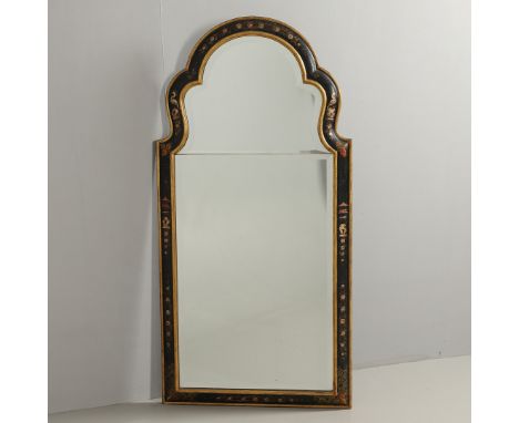 the arched top and frame decorated with cranes, pagodas and flowers upon a gilt and black lacquered ground to a sectional bev