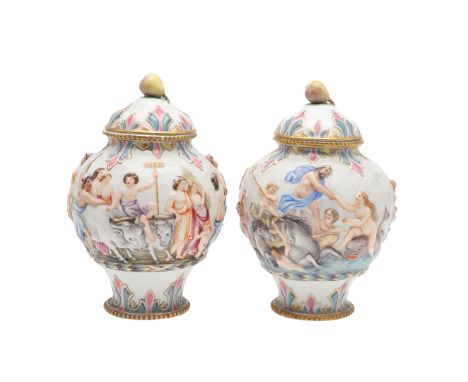 An unusual pair of lidded porcelain jars, each in low relief and including Neptune, mermaids and cherubs in a water scene, th