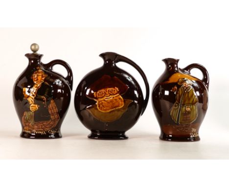 Three Royal Doulton Kings ware Dewars Scotch Whisky decanters. One with original metal stopper. Height of tallest: 20.5cm (3)