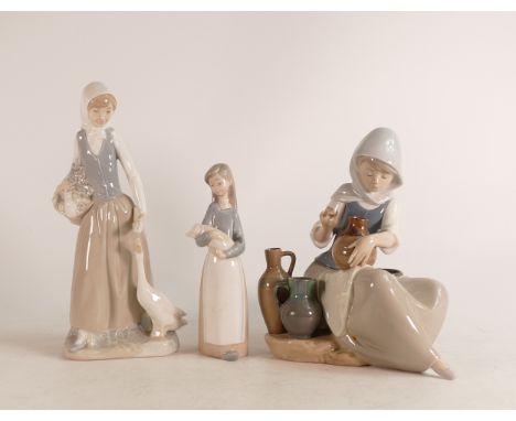 Two Lladro figures to include Woman Painting Vase 5079 (paintbrush damaged), Girl with Goose and Girl with Pig (3) 