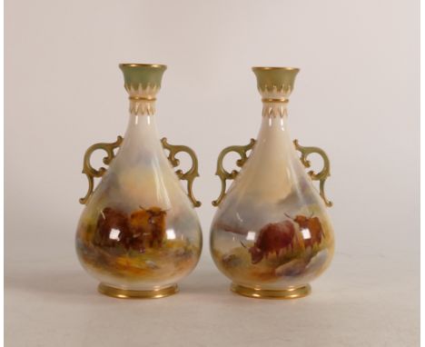 A pair of Royal Worcester twin handled vases decorated in the highland cattle design. Stamped to base G995, signed by Harry S