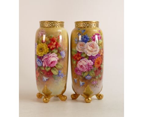 A pair of Royal Worcester footed vases by E Barker, decorated with Bouquet of flowers. Puce marks, height 22cm 