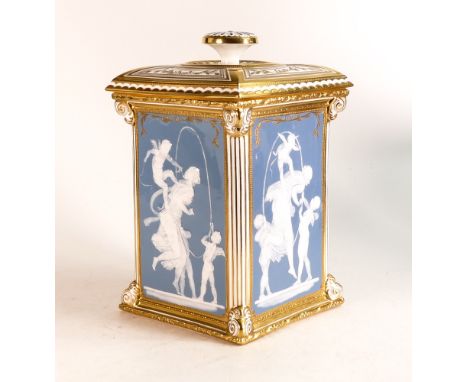 A prototype Minton Pate-Sur-Pate lidded pot of Lozenge form. Decorated with mirrored designs of Putti at Play on a light blue