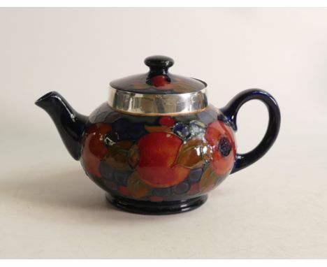 William Moorcroft Pomegranate tea pot, signed. Sterling silver collar replacement. Height 12.5cm 