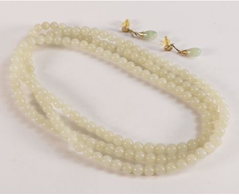 A Jade bead necklace, length 125cm, 107g together with a pair of Jade earrings with yellow metal Chinese mounts. 