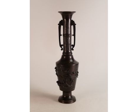 An early 20th century Bronze style Japanese twin handled vase. Moulded with naturalistic birds and cloud forms to handles. He