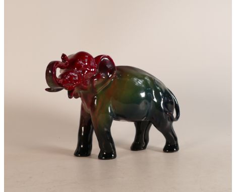 Royal Doulton Sung Flambe model of an Elephant with trunk in salute, in colours of blue/green and red, h.17.5cm.