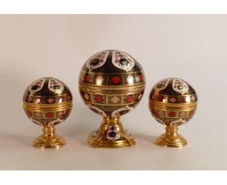 A set of three Royal Crown Derby paperweights, comprising Millennium Globe Clock, Millennium Globe Thermometer and Millennium