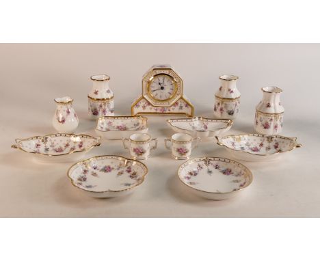 A collection of Royal Crown Derby Royal Antionette to include pin dishes, vases, mantle clock, miniature loving cups, etc. (1