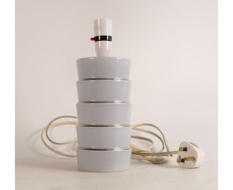 Keith Murray for Wedgwood, Skyscraper lamp in light blue. Silver gilt banding to each level. Height: 27cm 