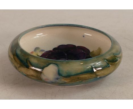 William Moorcroft footed dish decorated with Pansies on light green and cream ground, d.11cm.