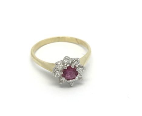 An 18carat gold ruby and diamond cluster ring size k.