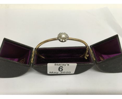 A Victorian 15ct (tested) gold, diamond and pearl bangle. Approx 9.9g