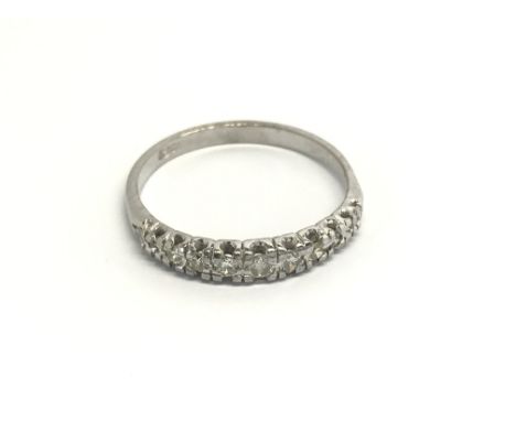 An 18carat gold ring a half hoop eternity ring set with a row of diamonds. ring size P.