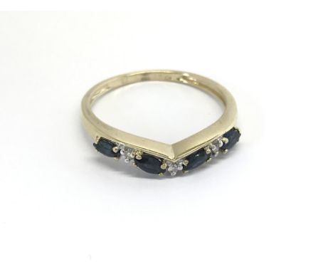 A 9carat gold ring set with four sapphires and diamonds ring size P.