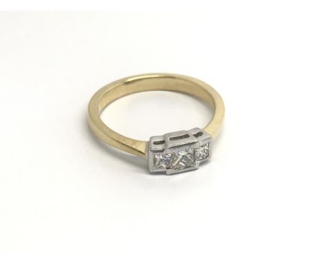 An18cart gold ring set with three princes cut diamonds of good colour G-H and good clarity approximately 0.33 of a carat. rin