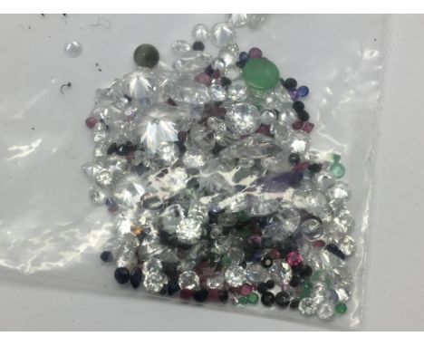 A bag of mixed loose stones including cubic zirconia, ruby, sapphire, amethyst and emerald 83.77ct