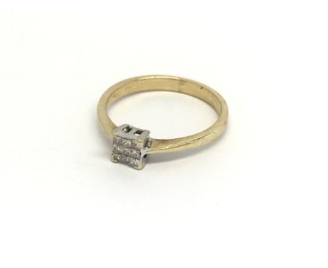 An 18 carat gold ring set with a square pattern of princess cut diamonds ring size K