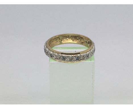 An unmarked gold eternity ring, approx 3g and approx size R-S.