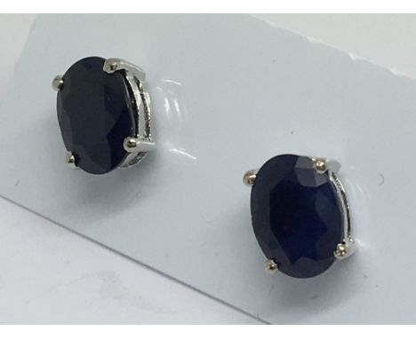 A pair of sapphire studs in silver