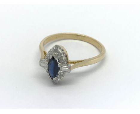 An 18carat gold ring set with a central marquise cut sapphire flanked by baguette and brilliant cut diamonds ring size Q-R.