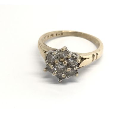 A 9carat gold ring set with a pattern of rose cut diamonds approximately 1carat total diamond weight O.