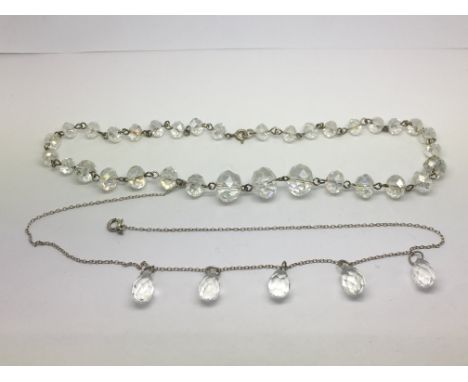 Two crystal necklaces with silver clasps.