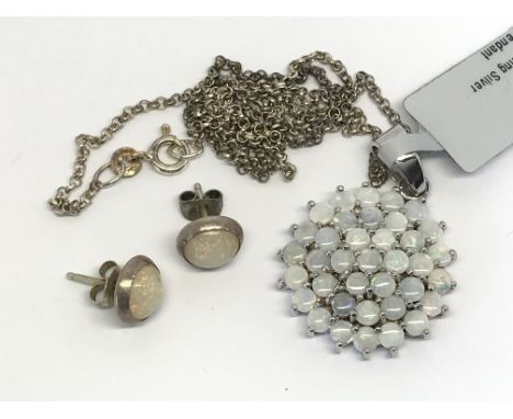 A silver and opal jewellery set consisting of necklace and earrings