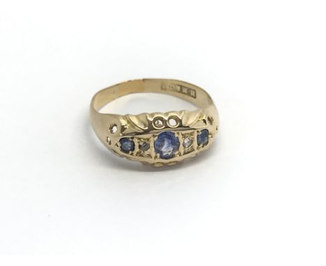 An 18carat Gold Edwardian ring set with three blue sapphire. Ring size K