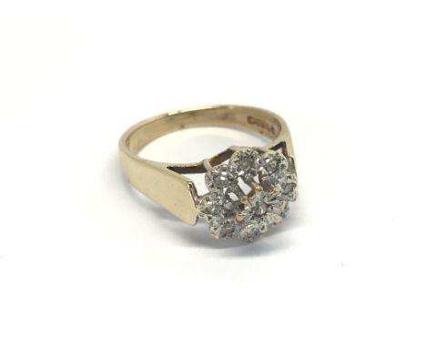 A 9carat gold ring set with a cluster of diamonds ring size N