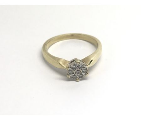 A 9carat gold ring set with a pattern of diamonds ring size N-O