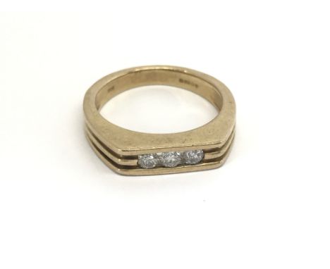 A Unisex 9carat gold ring set with three brilliant cut diamonds. ring size N