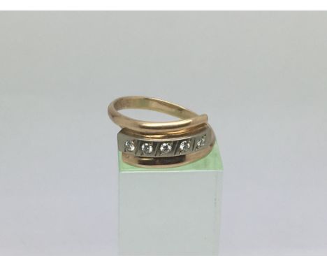 An unmarked hold ring set with five diamonds, approx 5.2g and approx size Q-R.