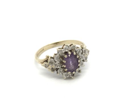 A 9carat gold ring set with an Amethyst and small diamond. ring size k.