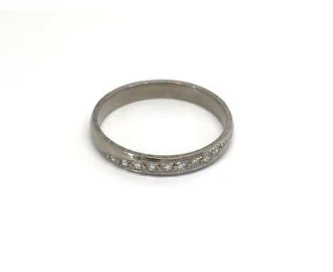 An unmarked gold ring set with diamonds ring size O