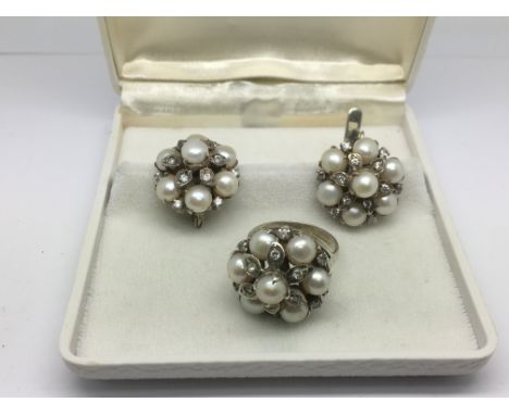 A pair of silver earrings set with cultured pearls and CZ stones together with a matching ring, approx size O-P.