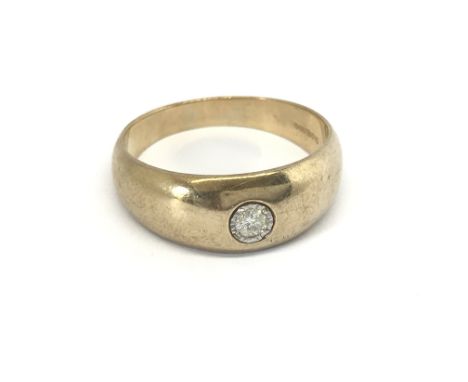 A Gents 9carat gold ring set with a brilliant cut solitaire diamond 0.15 of a carat ring size V-W