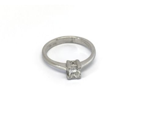A Platinum diamond solitaire ring set with a princes cut diamond 0.33 of a carat ring size H