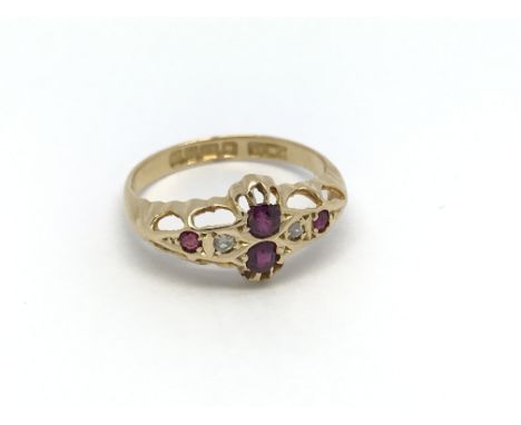 A 1920s ruby and diamond ring. Size J-K
