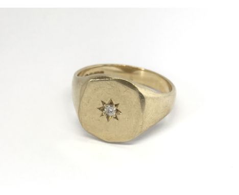 A Gents 9carat gold signet type ring set with a diamond ring size T-U