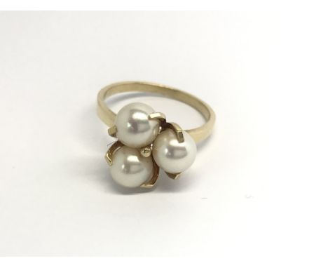 An 18carat gold ring set with three cultured pearls ring size P.