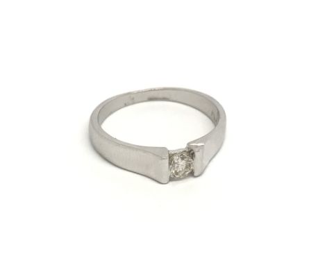 A modern design platinum ring set with a brilliant cut diamond. ring size K