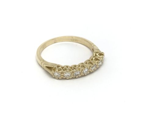 An 18ct gold seven stone diamond ring, approx .33ct, approx 2.5g and approx size K-L.